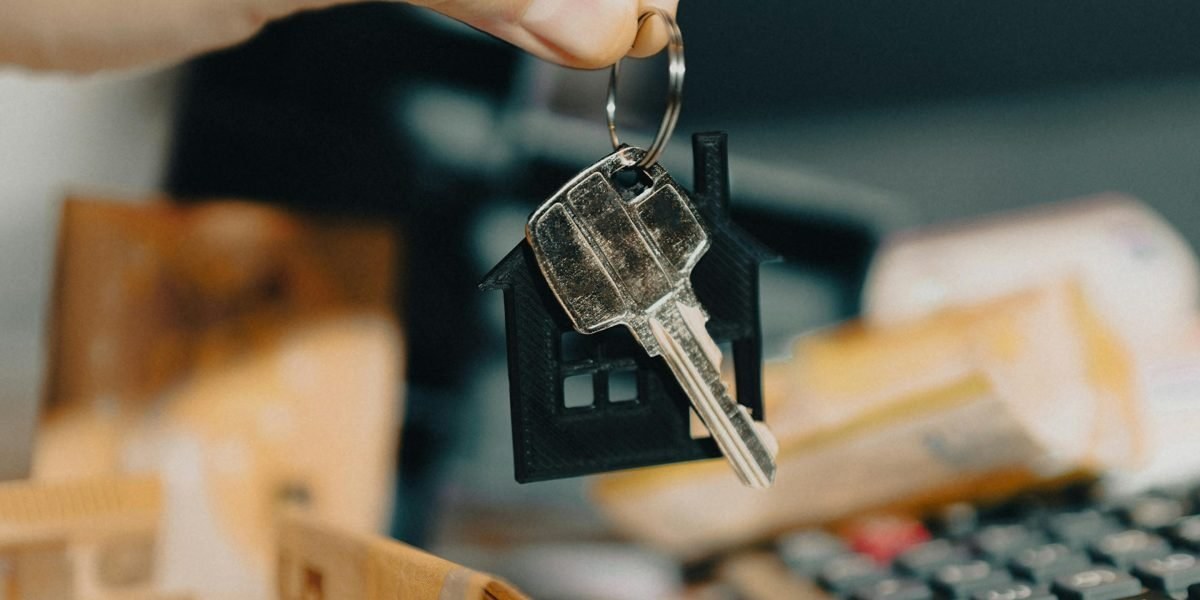 Close-up of property documents and keys
