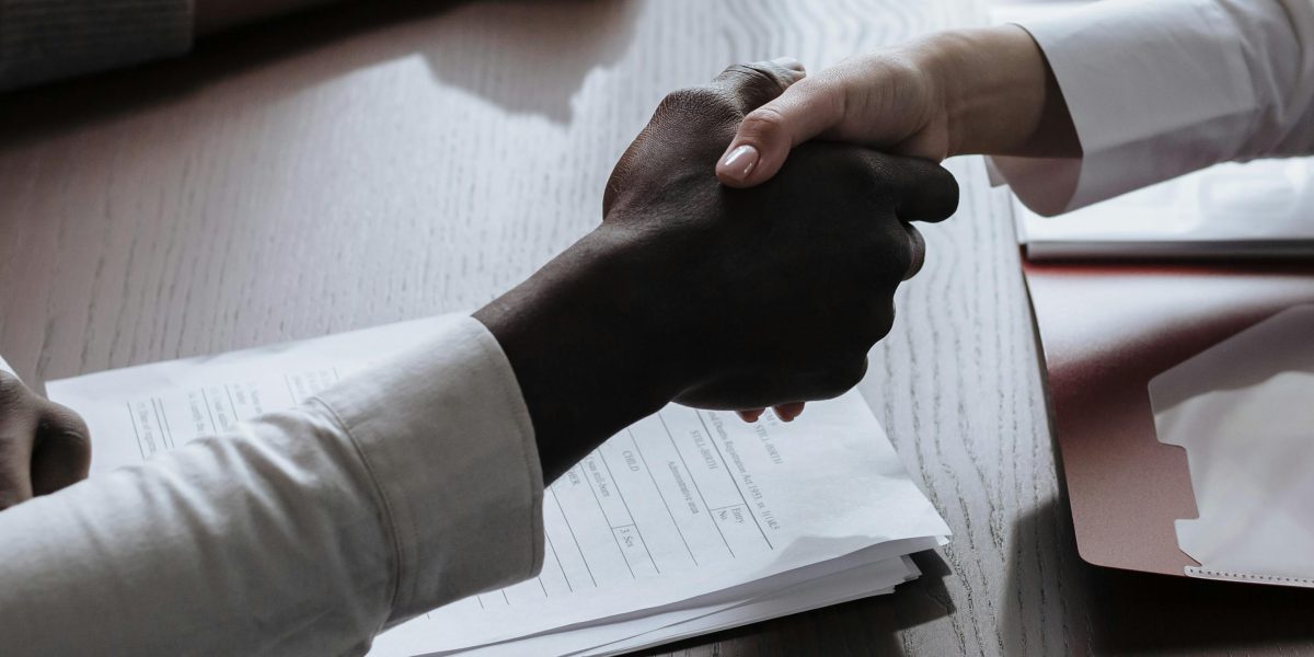 The culmination of a successful real estate transaction, symbolizing trust and agreement.